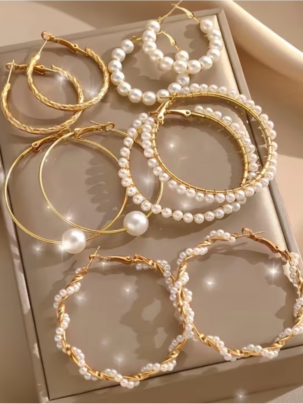 Set of Five Pairs of Gold Hoop Earrings with White Pearls